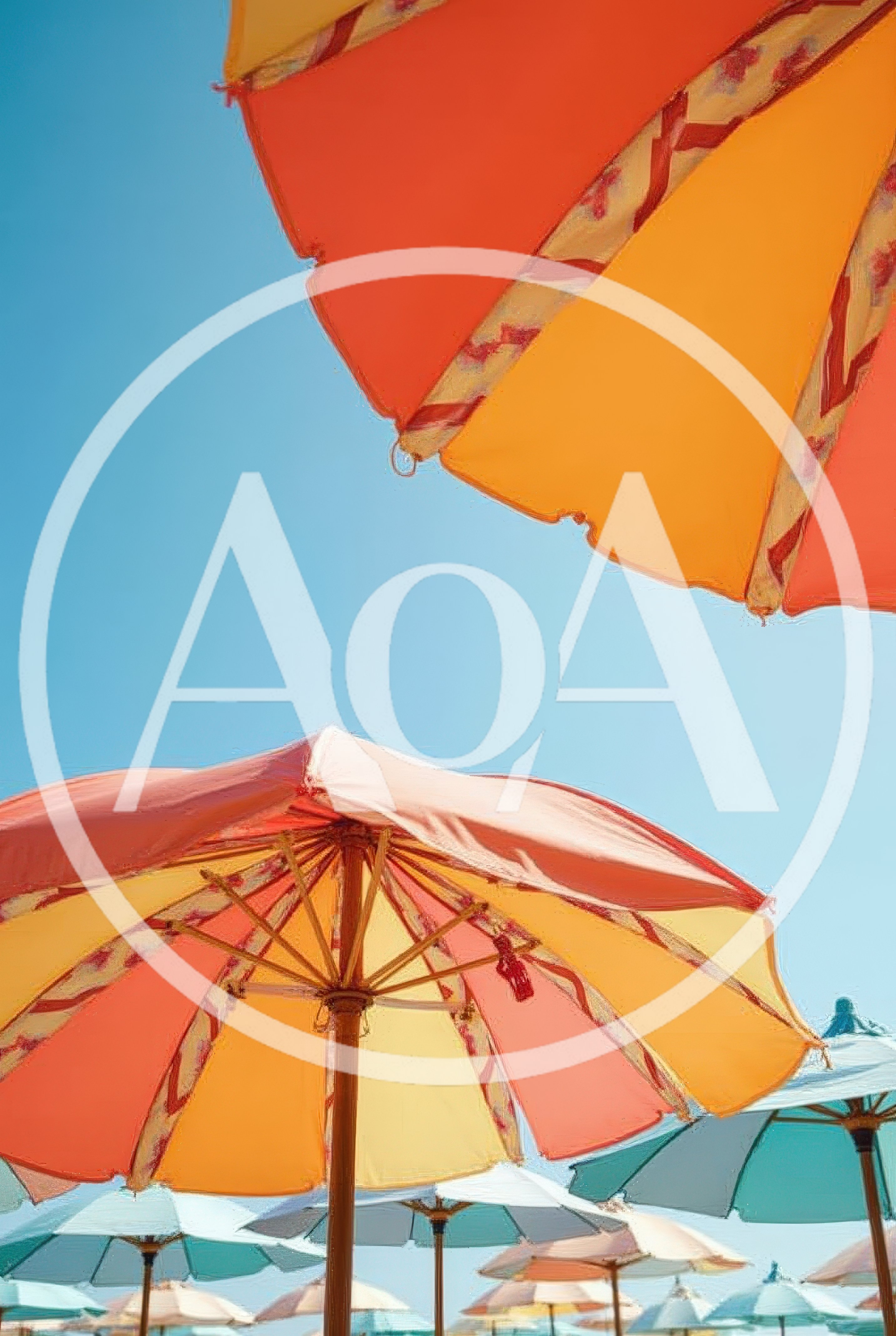 Colorful Beach Umbrellas Under A Clear Blue Sky