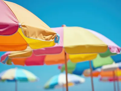 Colorful Beach Umbrellas Under A Clear Blue Sky
