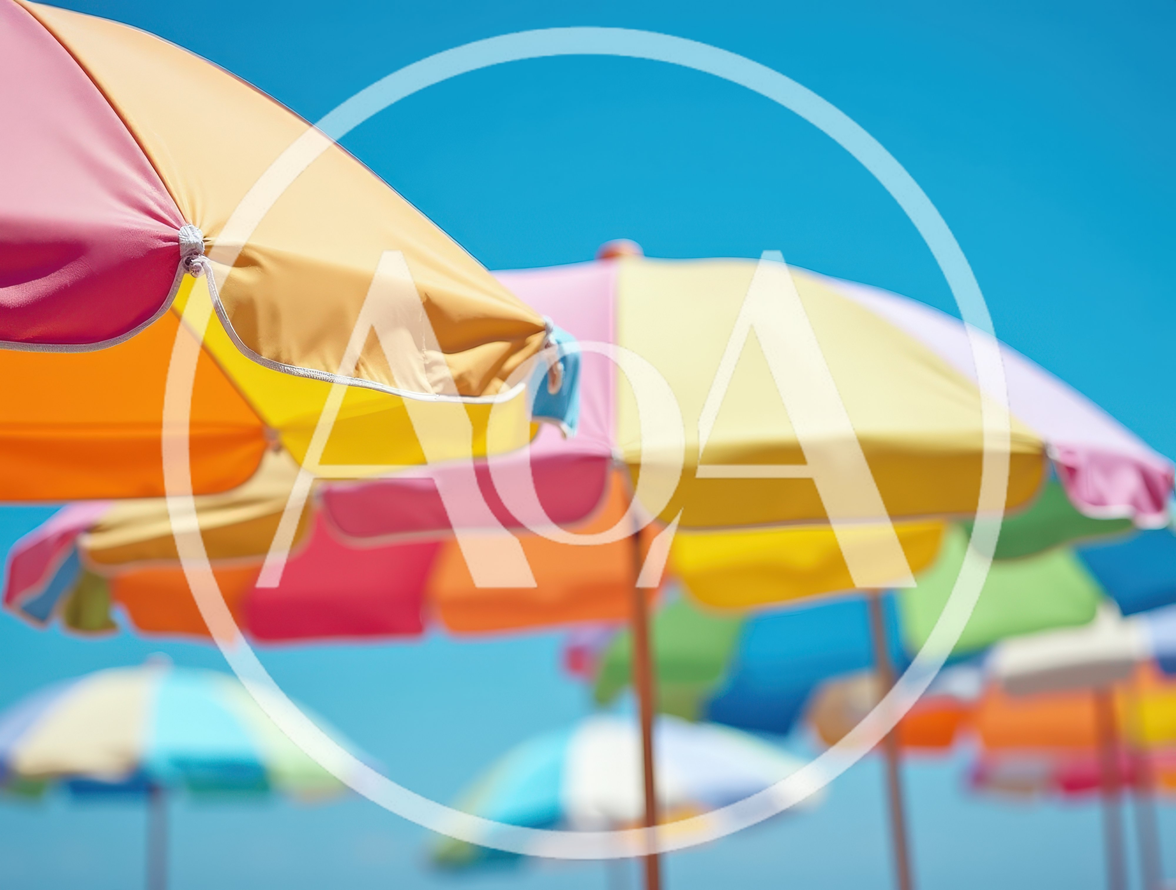 Colorful Beach Umbrellas Under A Clear Blue Sky