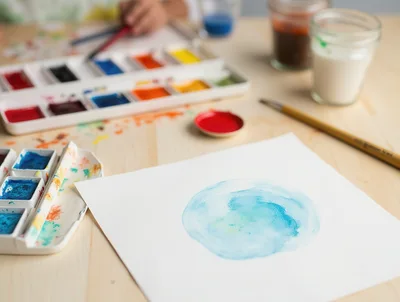 Watercolor Painting Activity on a Wooden Table