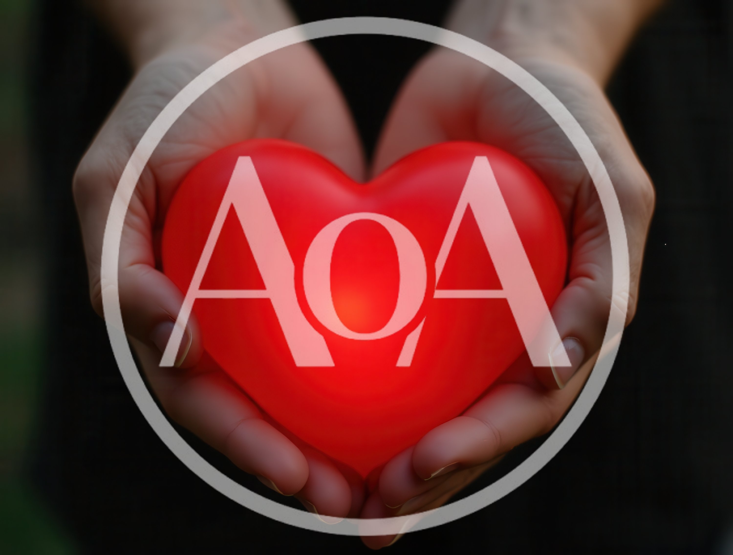 Person Holding A Glowing Red Heart Shape