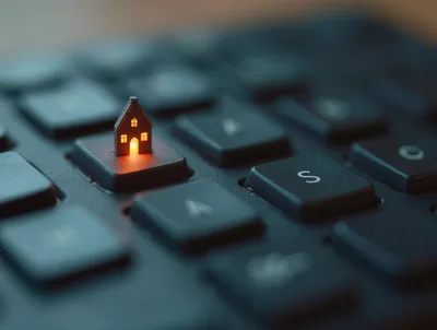 Miniature Glowing House Model On Computer Keyboard