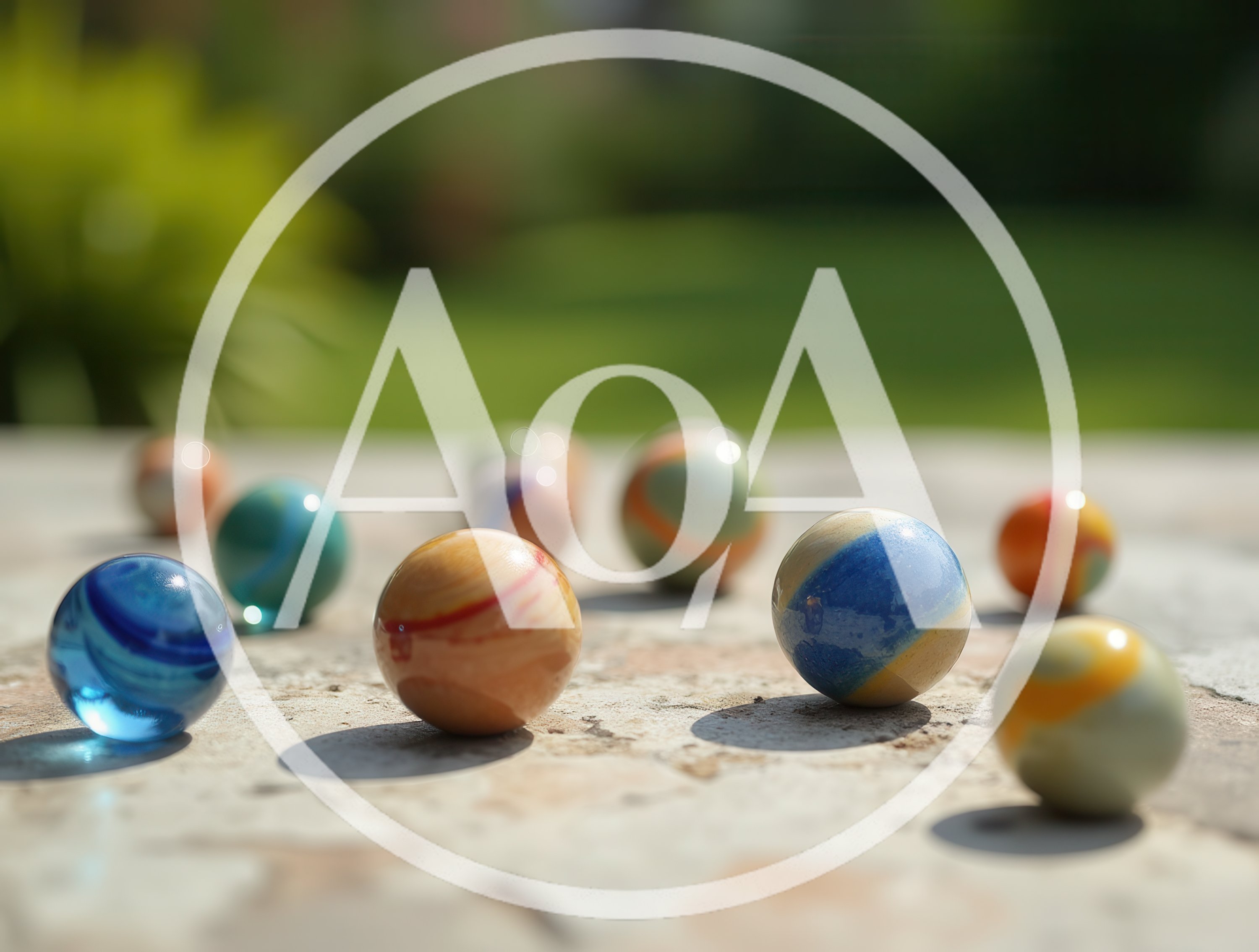 Colorful Glass Marbles Scattered on Stone Surface