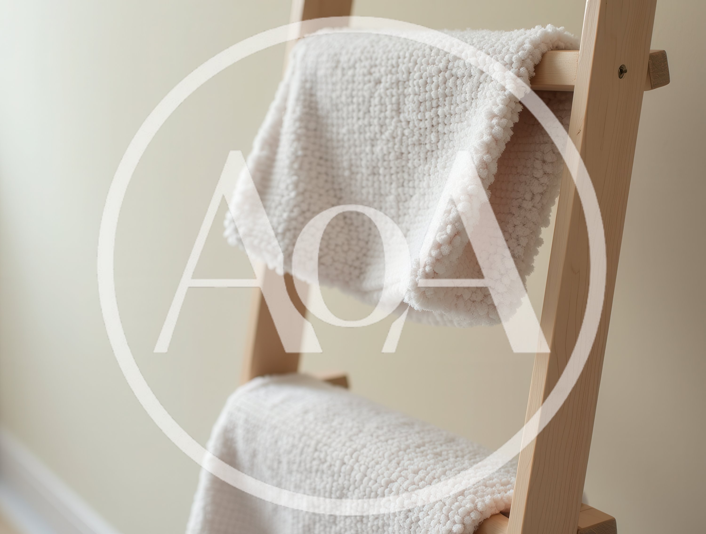 White Textured Blankets Hanging On Wooden Ladder
