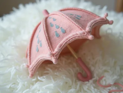 Miniature Pink Umbrella Toy on White Shag Rug