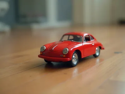 Red Porsche 356 Toy Car On Wooden Floor