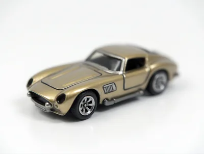 Gold Diecast Toy Sports Car On White Background