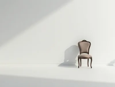 Single Antique Chair Against A Minimalist White Wall