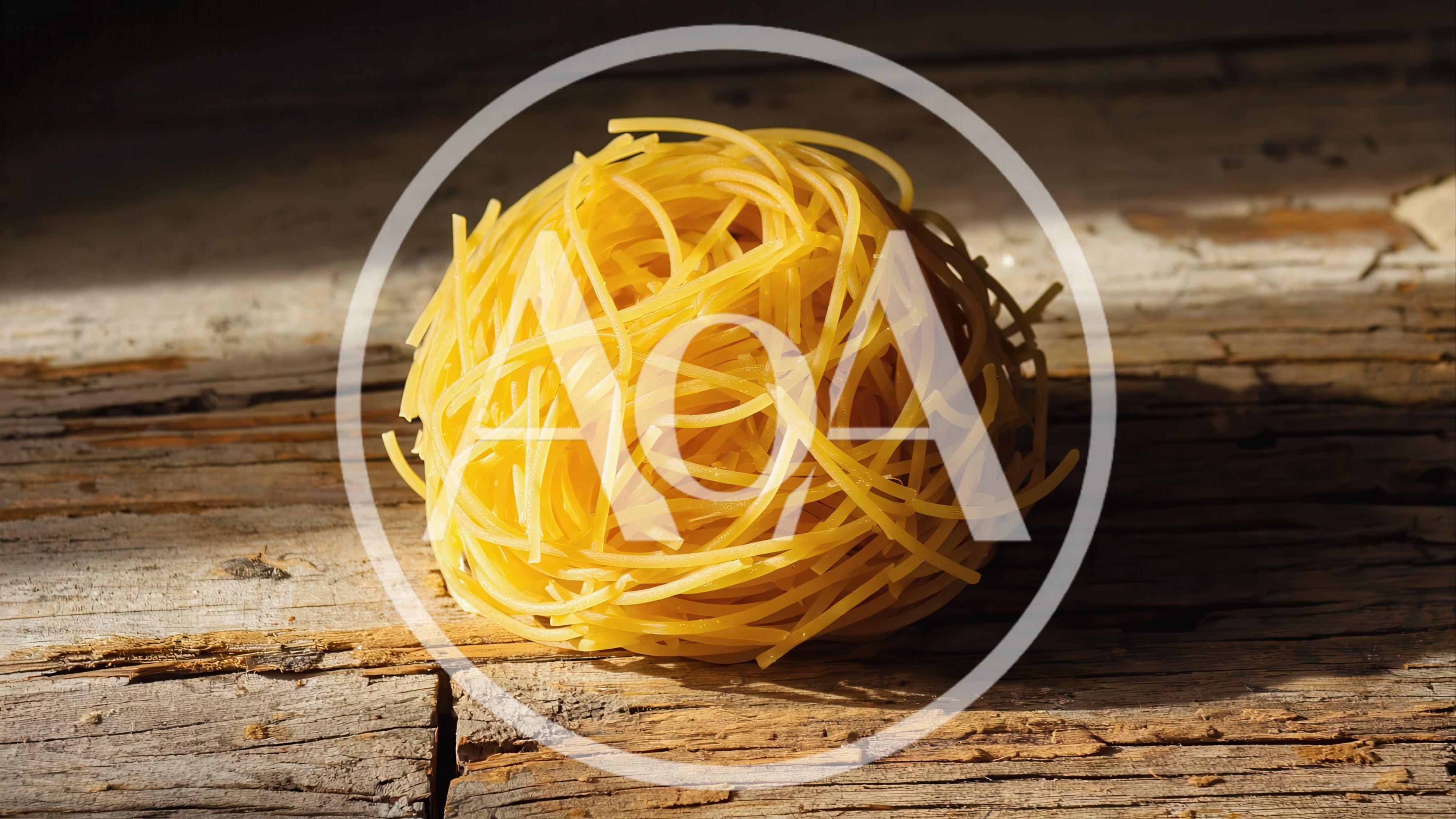 Single Nest Of Raw Pasta On Rustic Wooden Surface