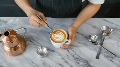 Barista Creating Latte Art With Etching Tool