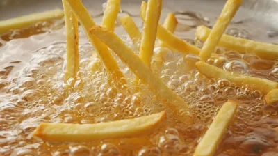 French Fries Frying In Hot Bubbling Oil