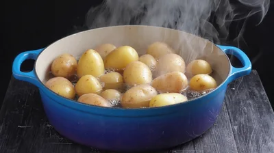 Potatoes Boiling In A Blue Enamel Pot