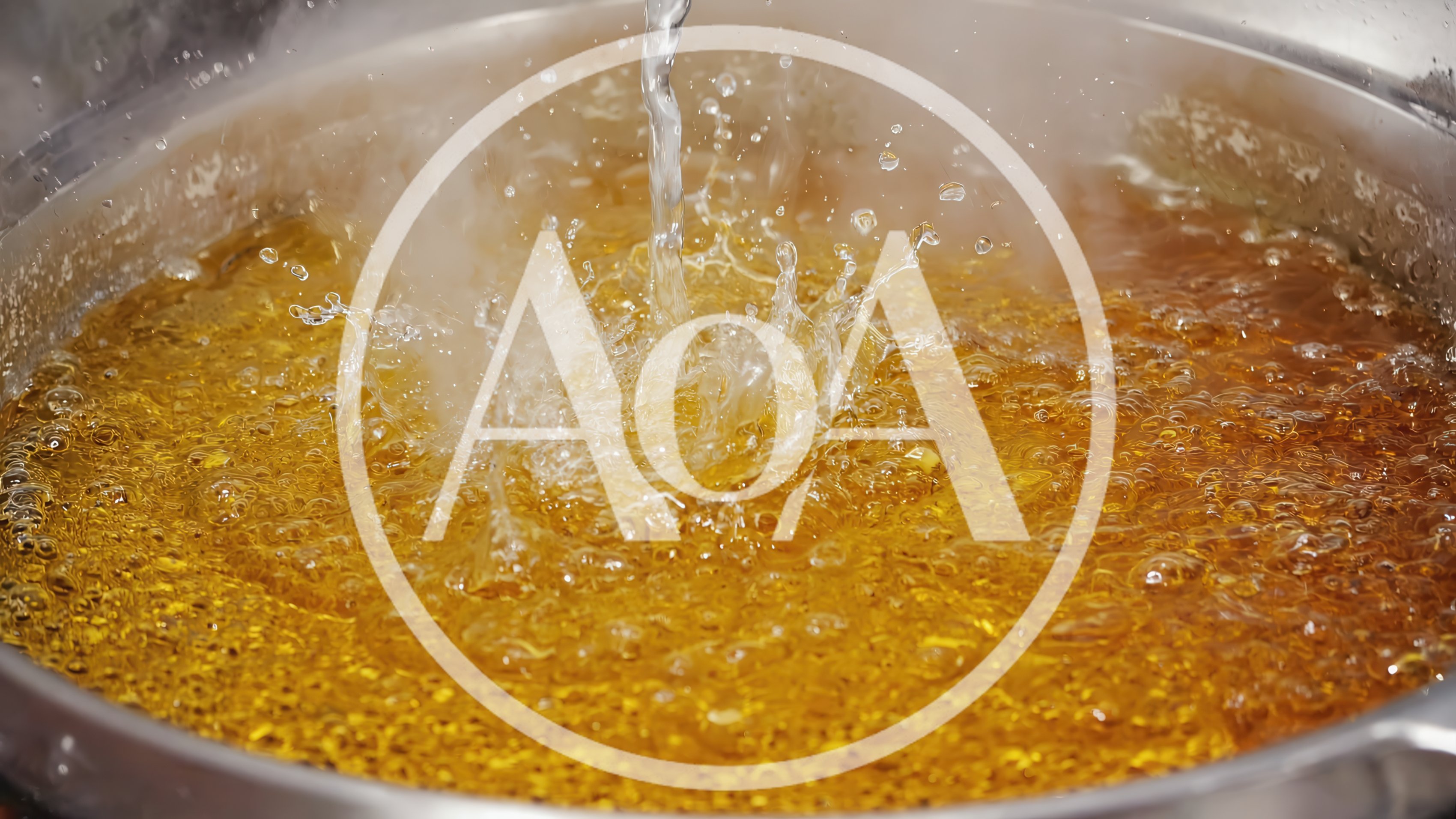Water Pouring Into Boiling Golden Oil