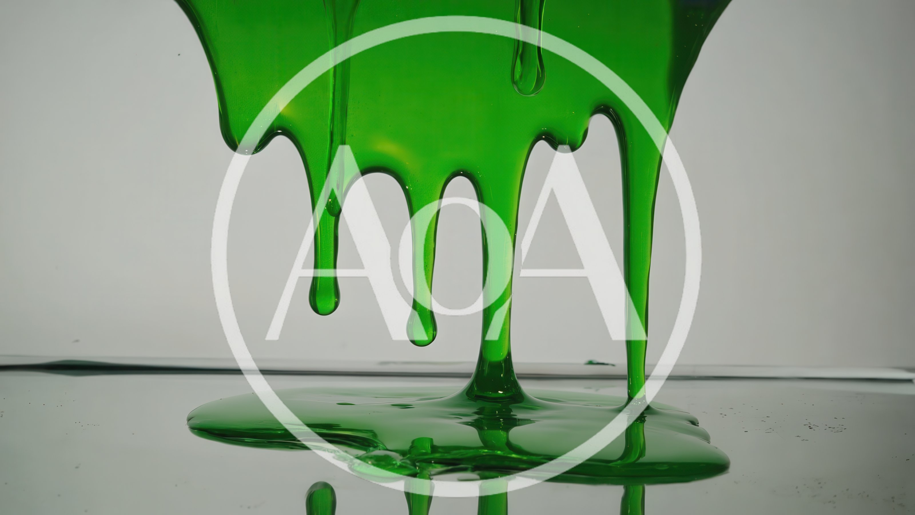 Green Slime Dripping Down Onto A Reflective Surface