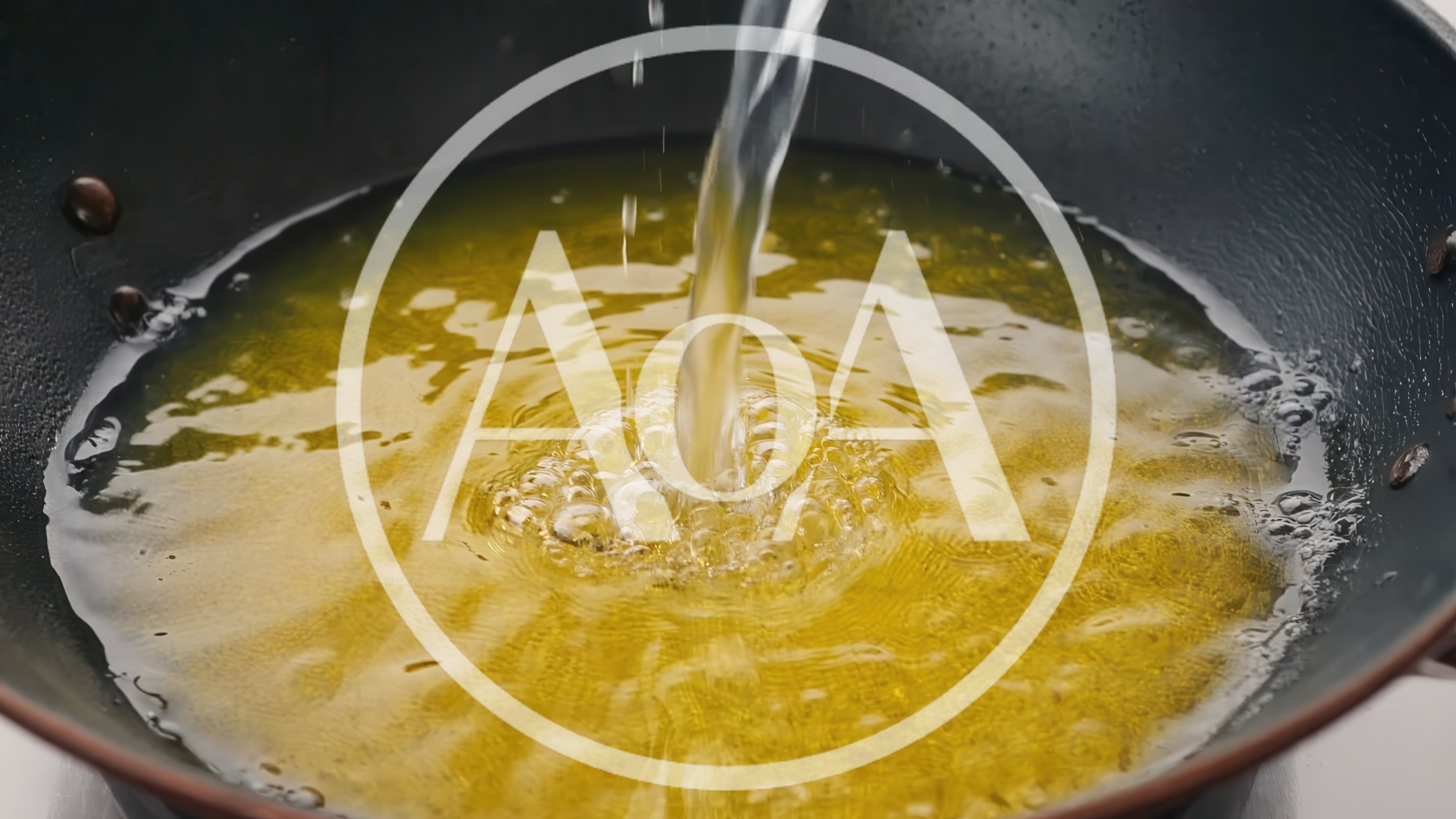 Pouring Clear Liquid Into Hot Cooking Oil