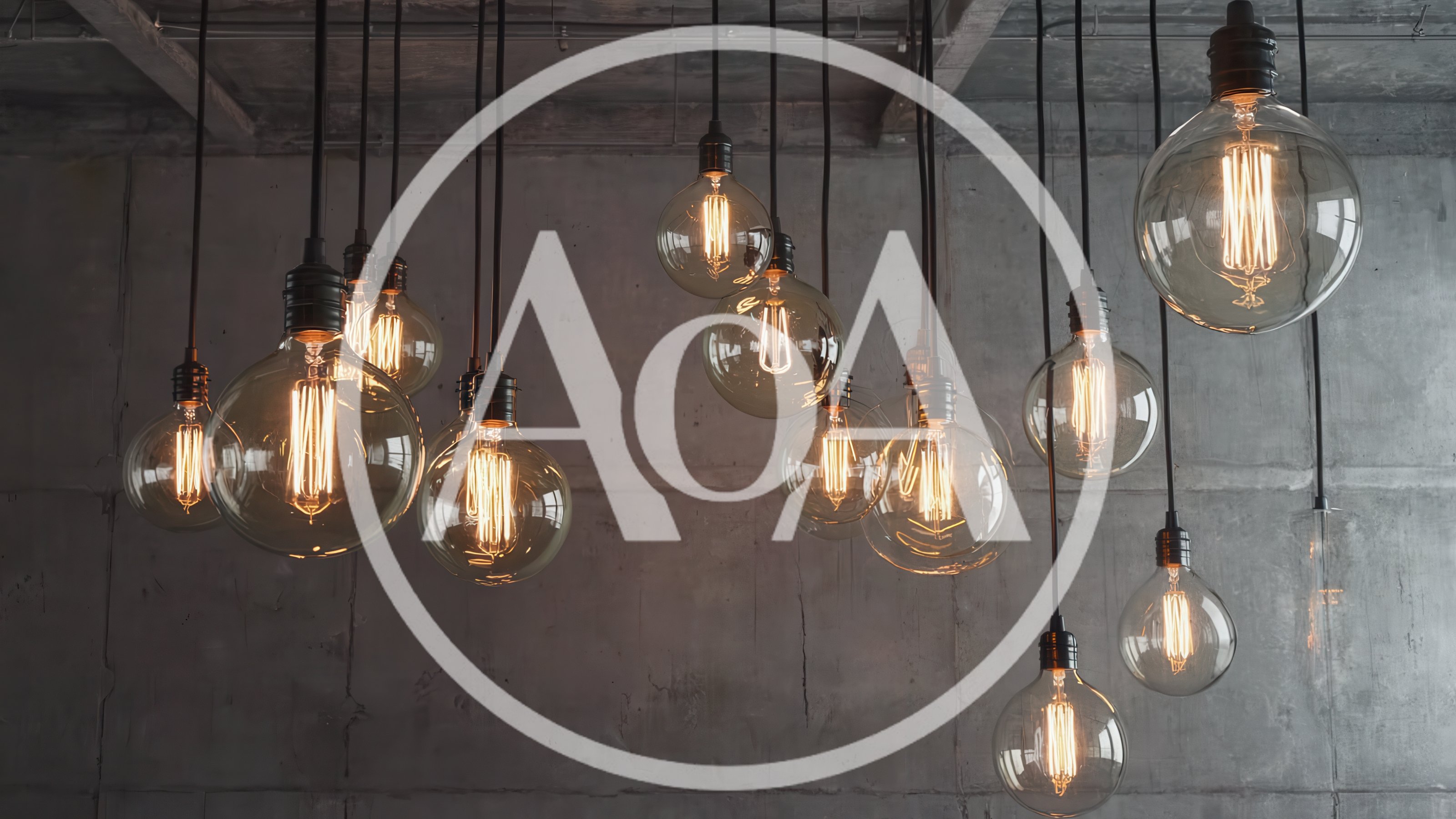 Vintage Edison Light Bulbs Hanging Against Concrete Wall