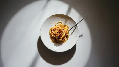 Spaghetti With Meat Sauce In A White Bowl