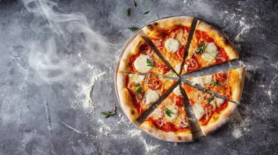 Freshly Baked Margherita Pizza With Steam On Dark Surface