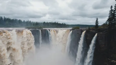 Wide Angle View Of Massive Waterfall In Forest