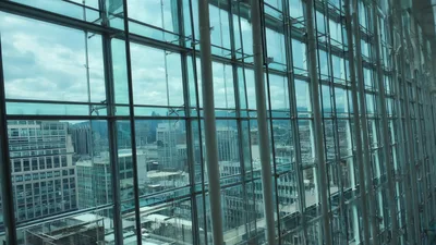 Modern Glass Skyscraper Window View Over Cityscape