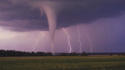 Tornado With Multiple Lightning Strikes Over Open Field