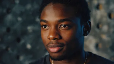 Portrait Of A Young Black Man Looking Away