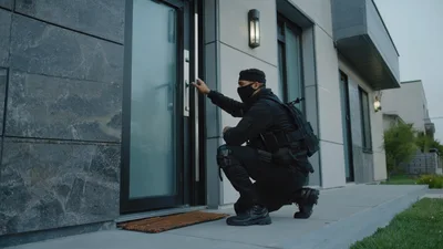 Burglar In Tactical Gear Attempting To Open House Door