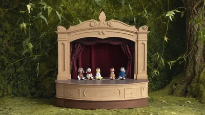 Small Puppet Theater Stage With Five Dolls In Forest
