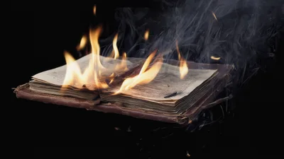 Old Leather Book Burning With Bright Flames