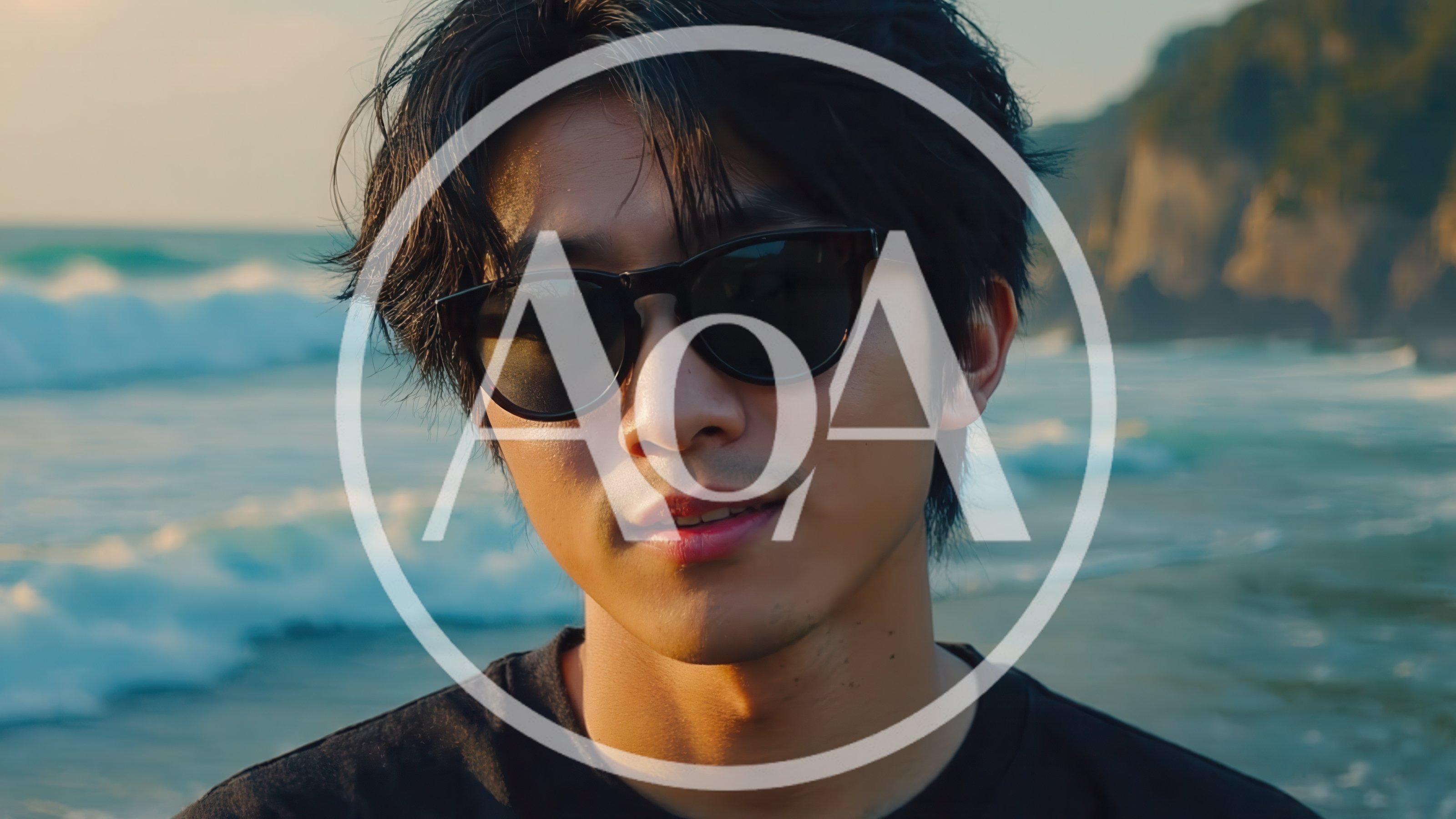 Young Asian Man Wearing Sunglasses At The Beach