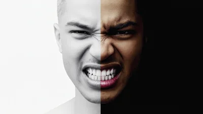 Split Face Portrait Showing Contrast Between Light And Dark