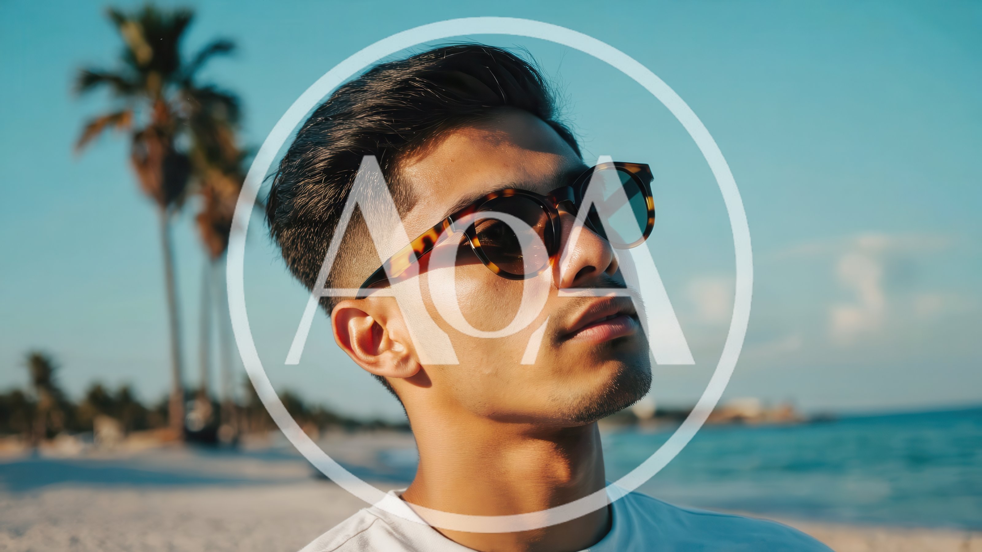 Young Man Wearing Sunglasses On A Sunny Beach