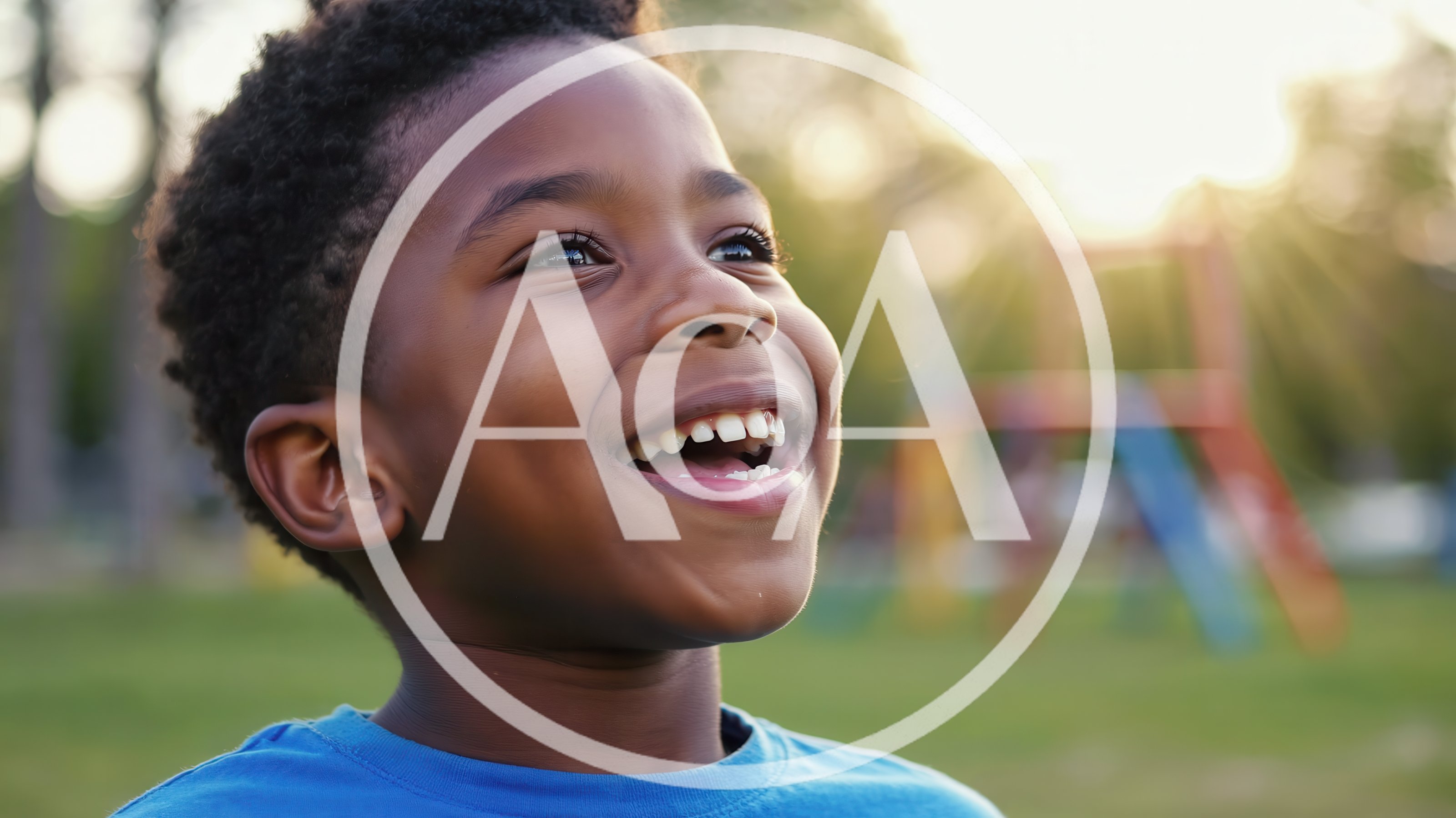 Happy Young Boy Smiling Outdoors at Playground