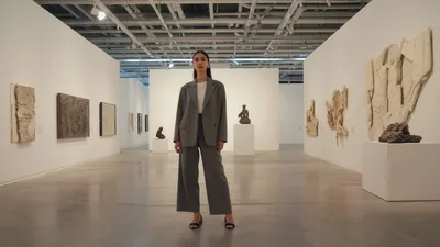 Young Woman Standing In A Modern Art Gallery