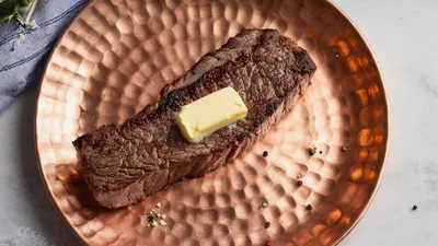 Grilled Beef Steak With Butter On Copper Plate