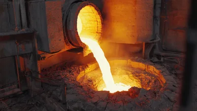 Molten Metal Pouring From Industrial Furnace