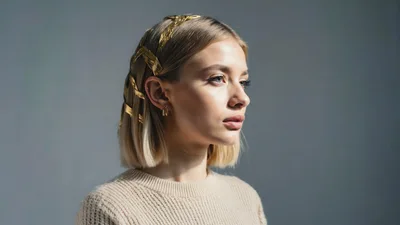 Portrait Of A Young Woman With Gold Hair Accessory