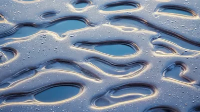 Abstract Frozen Ice Surface With Melted Puddles