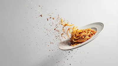 Spaghetti Dish Exploding With Seasoning Particles