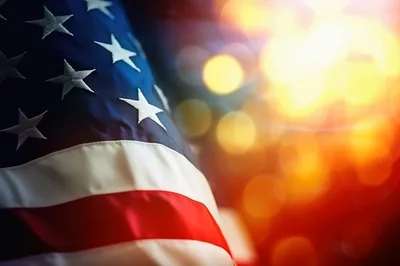 American Flag Waving With Soft Bokeh Background