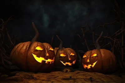Three Glowing Jack O Lanterns In Dark Forest