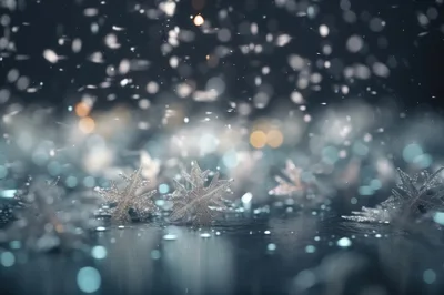 Decorative Snowflake Ornaments Resting On A Reflective Surface