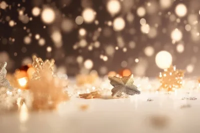 Golden Christmas Ornaments With Bokeh Lights Background