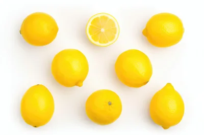 Fresh Yellow Lemons Arranged On White Background