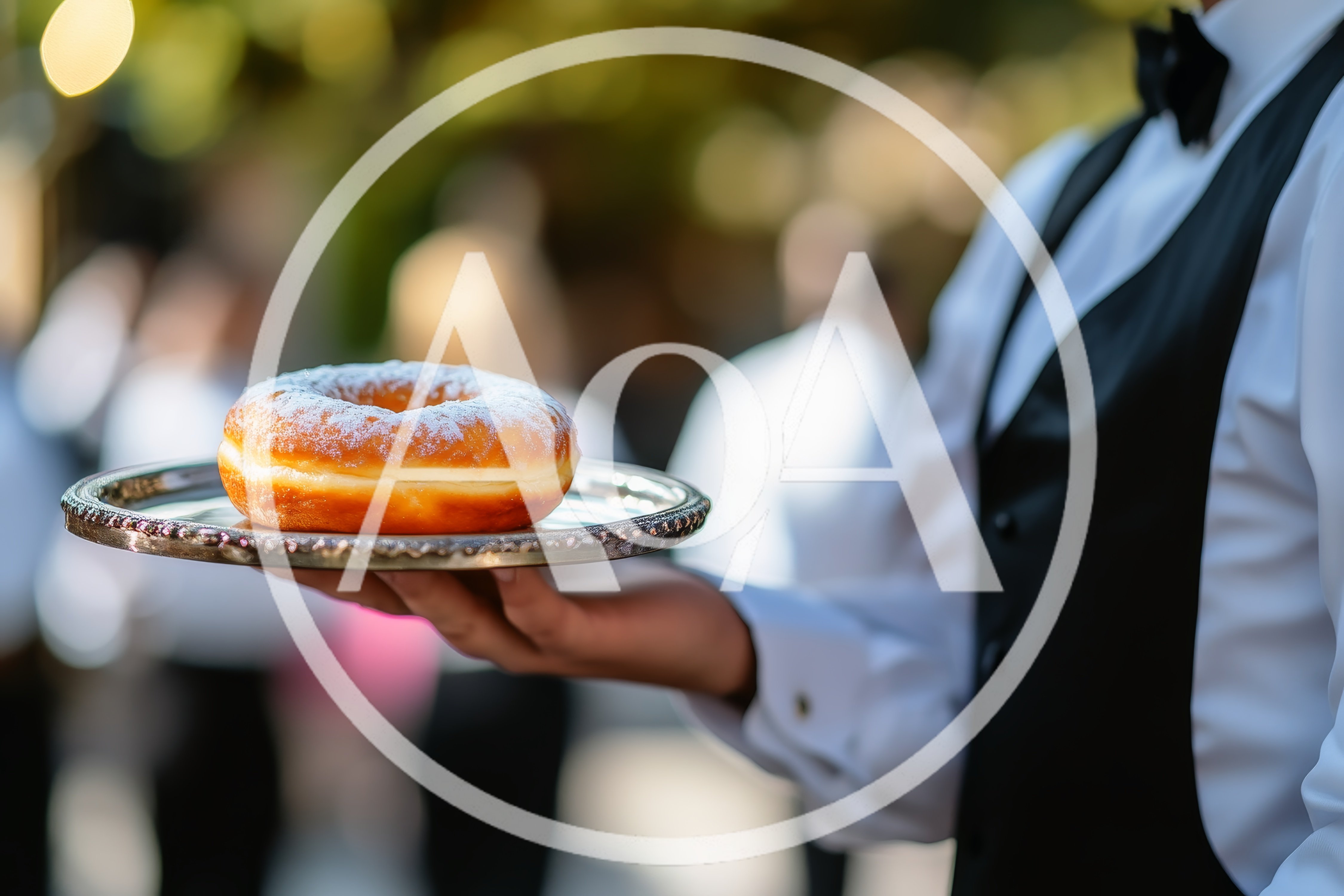 Waiter Serving A Single Sugared Donut On A Silver Tray
