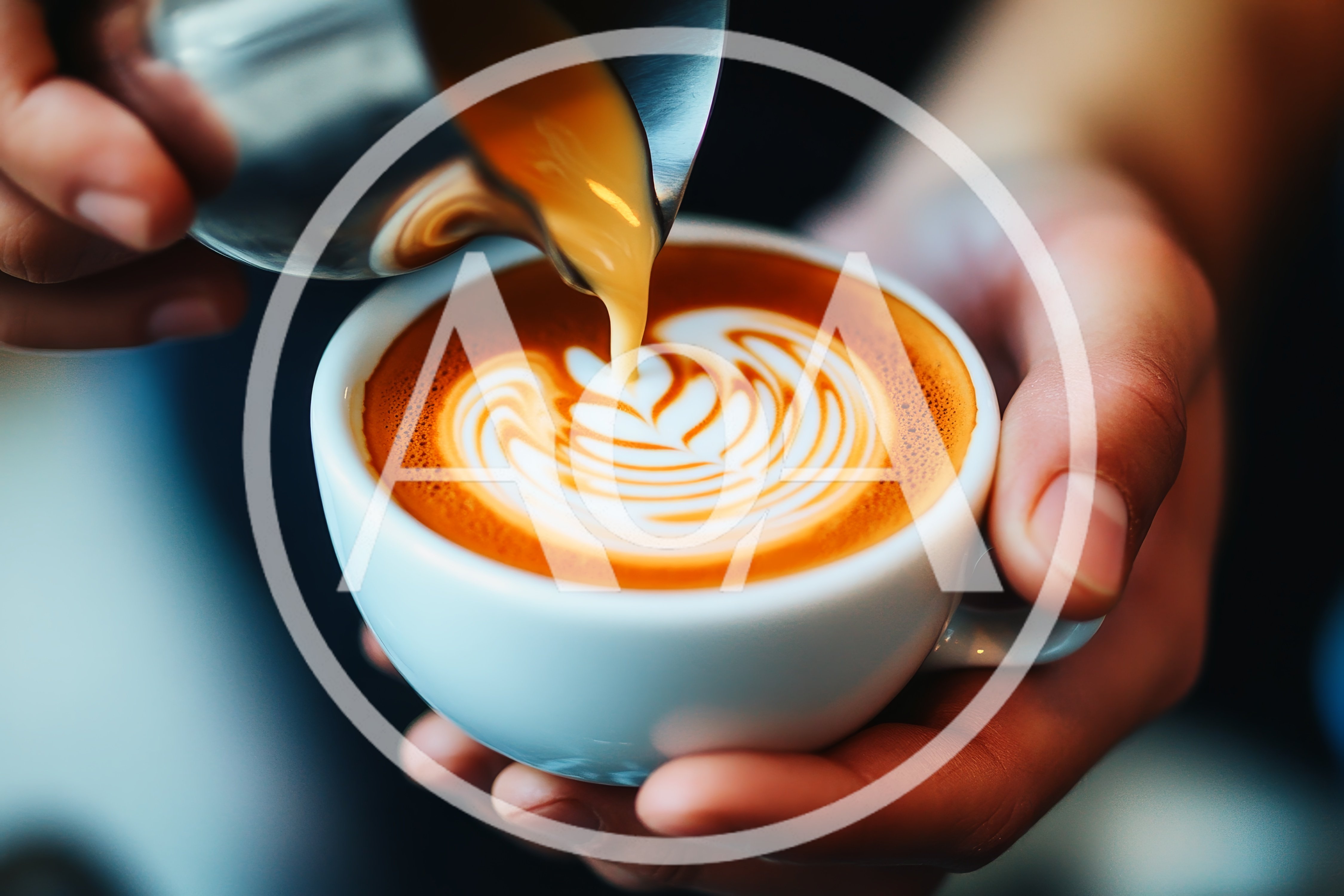Barista Pouring Steamed Milk Into A Latte