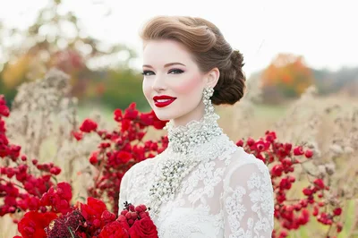 Elegant Bride With Red Roses In Autumn Field
