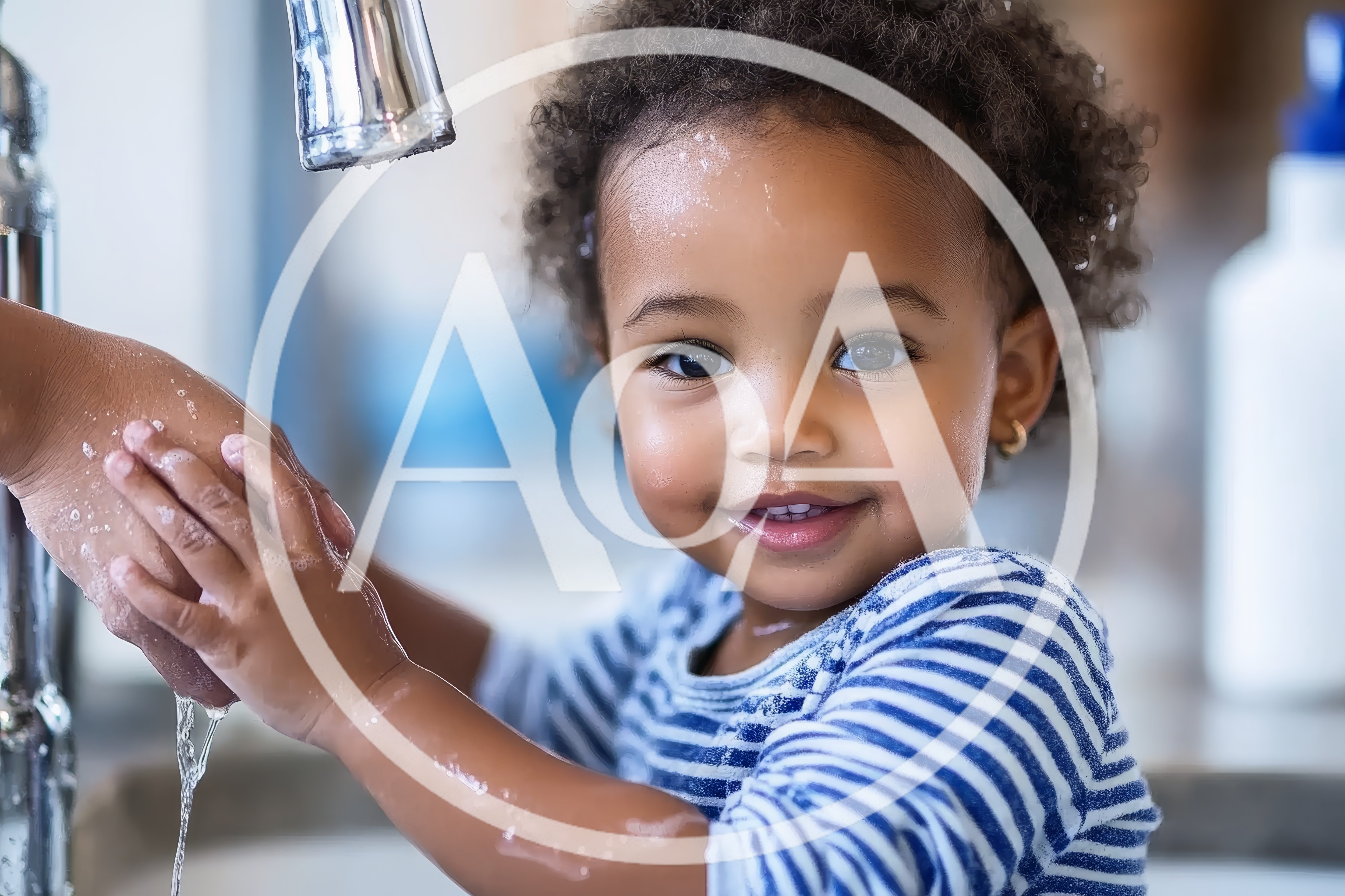 Toddler Washing Hands With Parent At Kitchen Sink