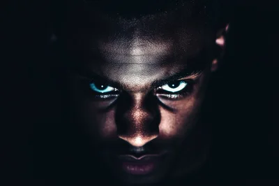 Close Up Portrait Of A Man With Glowing Eyes