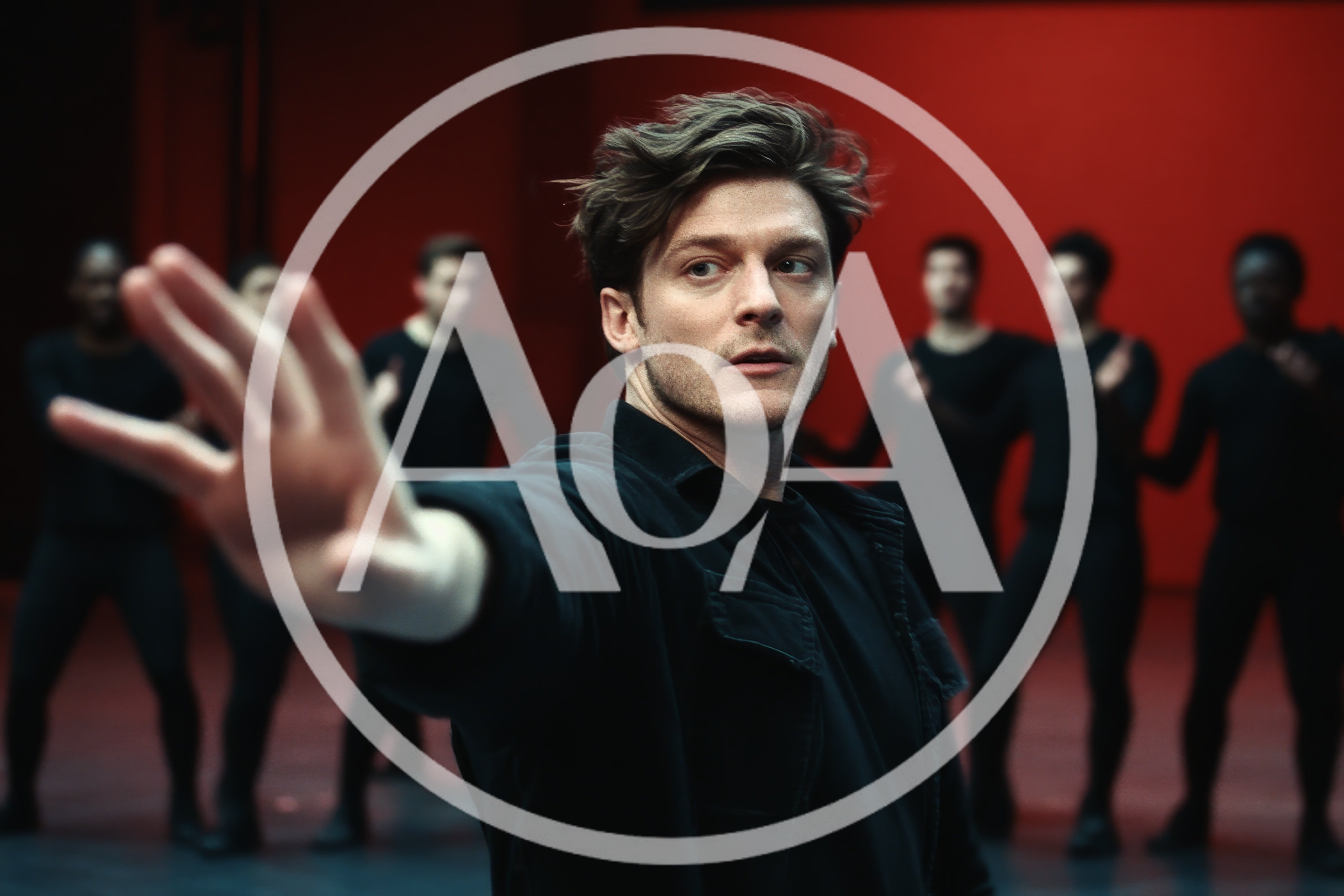 Male Dancer Performing Contemporary Choreography In Red Studio